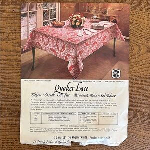 Vintage Quaker Lace tablecloth.‎ 70 inch round. White lace over red liner.